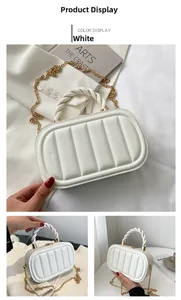 Detailed close-up of a white quilted handbag featuring golden chain and woven handle