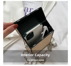 Vertical wood grain box bag with chain showing internal capacity for phone and glasses