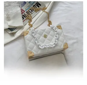 Detailed comparison of white lychee pattern box bag size relative to a smartphone