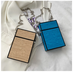 Vertical wood grain box clutch bag in blue and natural colors with silver chain