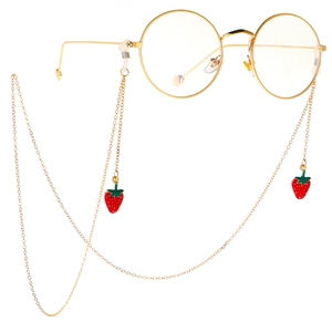 Chaîne de lunettes dorée avec pendentifs fraises sur lunettes rondes à monture or