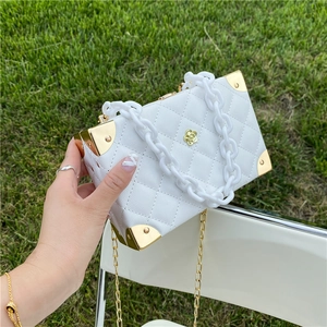 White litchi pattern square box bag with gold flower logo and acrylic chain straps