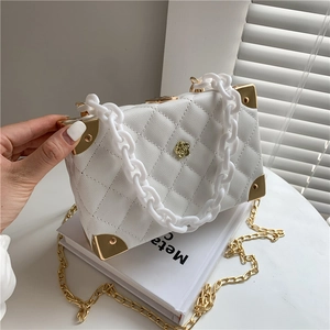 White quilted box bag with acrylic chain and gold floral buckle for women