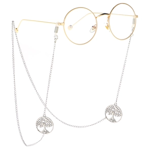 Silver tree of life sunglass chain attached to gold round glasses on white background