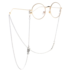 Minimalist silver fishbone eyewear chain for women on gold round glasses