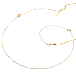 Chaîne de lunettes dorée élégante avec accents de perles et boucles en silicone