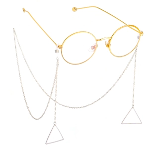 Golden metal eyewear chain with minimalist triangle pendants on round frame glasses