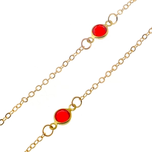 Golden eyewear chain with minimalist red acrylic beads on a polished metal link strap