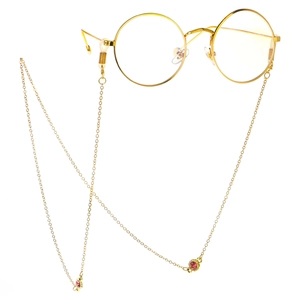 Lunettes rondes dorées avec chaîne en strass élégante et accents de pierres rouges