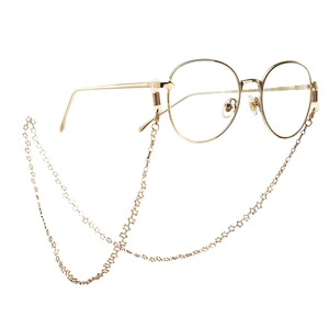 Round gold glasses with a matching handmade metal chain featuring hollow star charms
