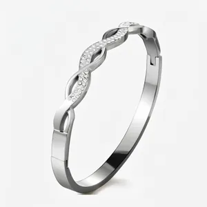 Detailed view of silver twisted bracelet with clear rhinestones and mechanical side clasp