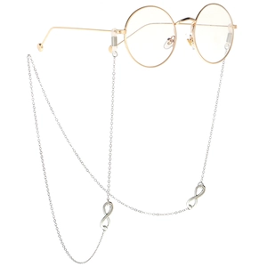 Silver infinity link glasses chain with gold round frames on a minimalist white background
