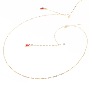 Golden metal eyewear chain featuring red and green enamel watermelon charms and silicone loops