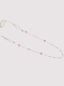 Detail of silver chain with pink beads and silicone loops for glasses fashion cord
