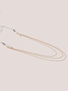 Detailed view of triple-layered gold metal eyeglass chain with black rubber loop connectors