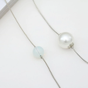 Elegant chain with large white pearl, blue bead, and floral metal detail for glasses