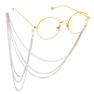Retro round gold glasses with multi-layer hanging silver chain tassels on white background