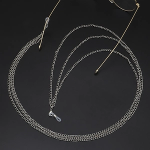 Detail of multi-layered silver metal eyeglass chain with anti-slip silicone connectors