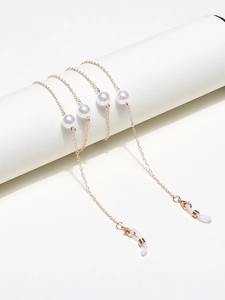 Elegant gold metal eyeglass chain with large white pearls and anti-slip silicone loops