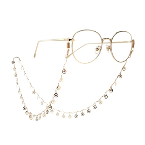 Elegante goldene Brillenkette aus Metall mit lächelnden Gesichtern und feinen Gliedern