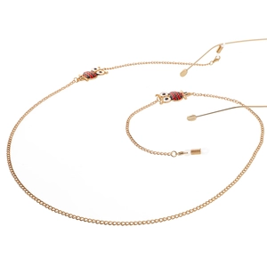 Golden metal eyewear chain with enamel owl charms and non-slip silicone loops