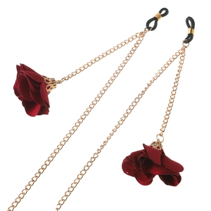 Golden metal eyewear chain featuring deep red fabric roses and black rubber loop ends