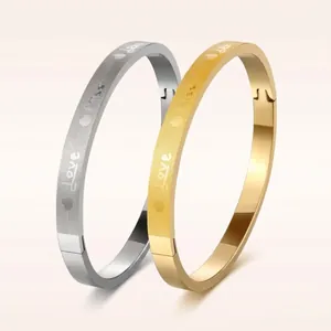 Polished matte stainless steel bangles in gold and silver with Love heart engraving
