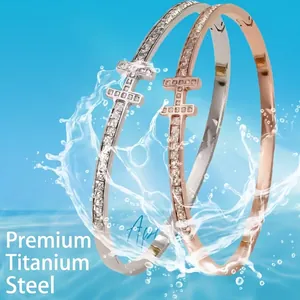 T-shaped titanium steel bracelets with pave crystals in silver and rose gold finishes