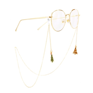Golden metal glasses chain with festive Christmas tree pendants on round glasses