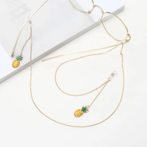 Golden metal eyewear chain featuring yellow and green enamel pineapple pendants for glasses