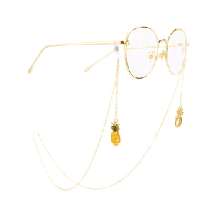 Golden metal glasses chain with yellow pineapple pendants and round frame glasses