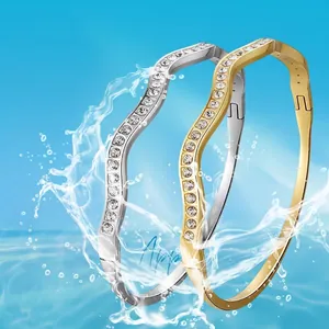 Waterproof wavy titanium steel bracelets with pavé zircons in gold and silver finish