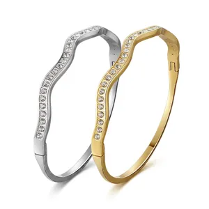 Luxe stainless steel wave hinged bracelets with pavé crystals in silver and rose gold finish