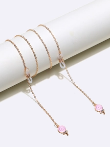 Detail of gold glasses chain with pink candy charms and anti-slip silicone loops