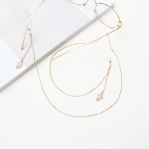 Golden eyeglass chain featuring pink candy pendant and anti-slip silicone loops