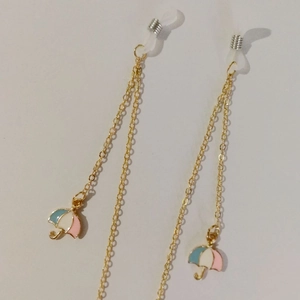 Golden metal eyewear chain featuring colorful enamel umbrella pendants and silicone loops