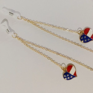 Golden metal eyewear chain with American flag heart pendants and silicone loops