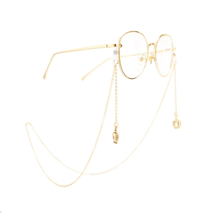 Golden eyewear chain with hollow crown pendants and vintage round frame glasses