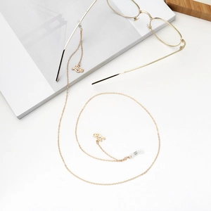 Gold eyeglasses chain with Love heart pendants and rhinestones on a minimalist frame