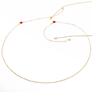 Golden metal eyewear chain featuring red rhinestone pendants and non-slip rubber loops