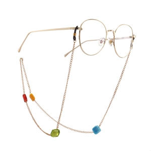 Golden chain for glasses featuring colorful square glass beads and oval metallic frames