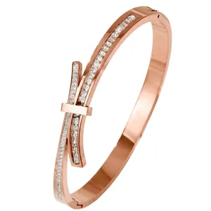 Rose gold bow design stainless steel bangle with white cubic zirconia, 58mm diameter