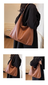 Detail of large brown hobo tote bag featuring premium lychee pattern leather texture