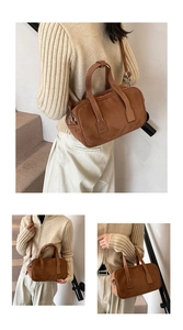 Detail of vintage matte brown suede Boston bag with adjustable strap and dual handles