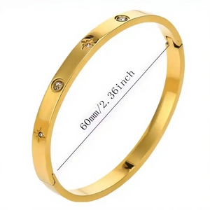Gold starburst bangle with sparkling cubic zirconia and 60mm inner diameter