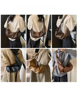 Detail showing vintage crescent bags in dark brown, black, and caramel with knot shoulder straps