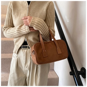 Brown frosted suede Boston bag featuring white contrast stitching and soft metal hardware