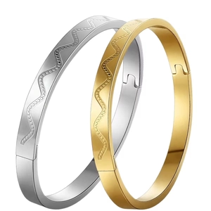 Minimalist wave-patterned stainless steel bangles in silver and gold high-polish finish
