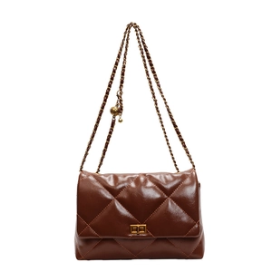 Quilted dark brown leather shoulder bag with gold chain and ball adjustment detail