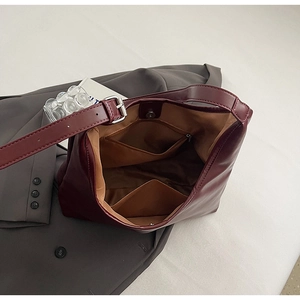 Interior view of wine red Hobo bag showing spacious compartments and magnetic closure